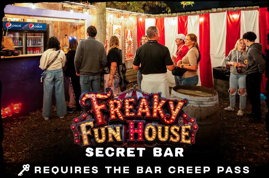A lively outdoor bar area featuring red and white striped circus tent walls and hanging string lights, with patrons standing around enjoying drinks. The text reads "Freaky Fun House Secret Bar. Requires the Bar Creep Pass."