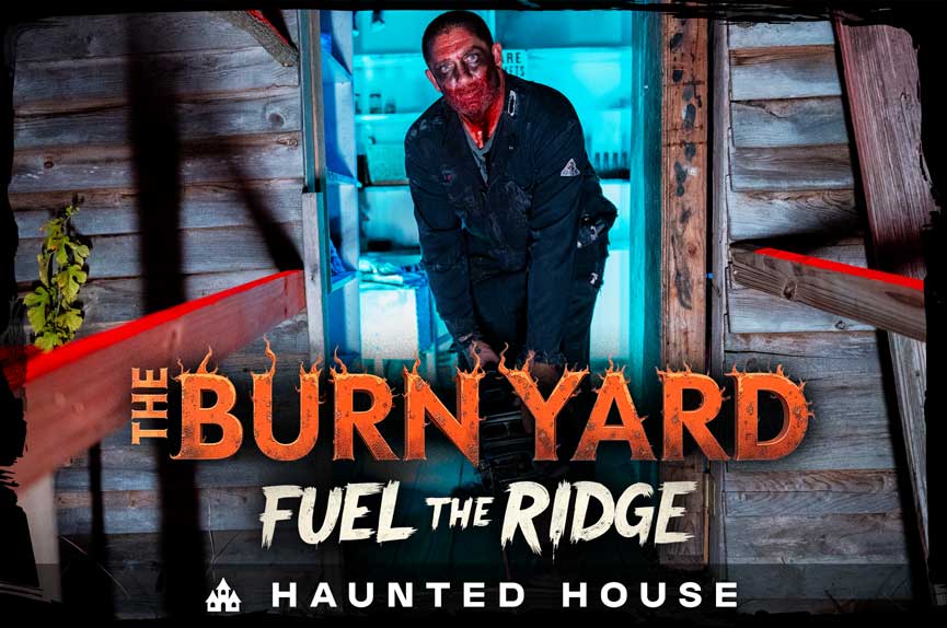 A menacing, soot-covered man with a bloody face wields a chainsaw as he steps out of a dilapidated wooden shack lit with eerie blue light. The text reads "The Burn Yard: Fuel the Ridge. Haunted House."